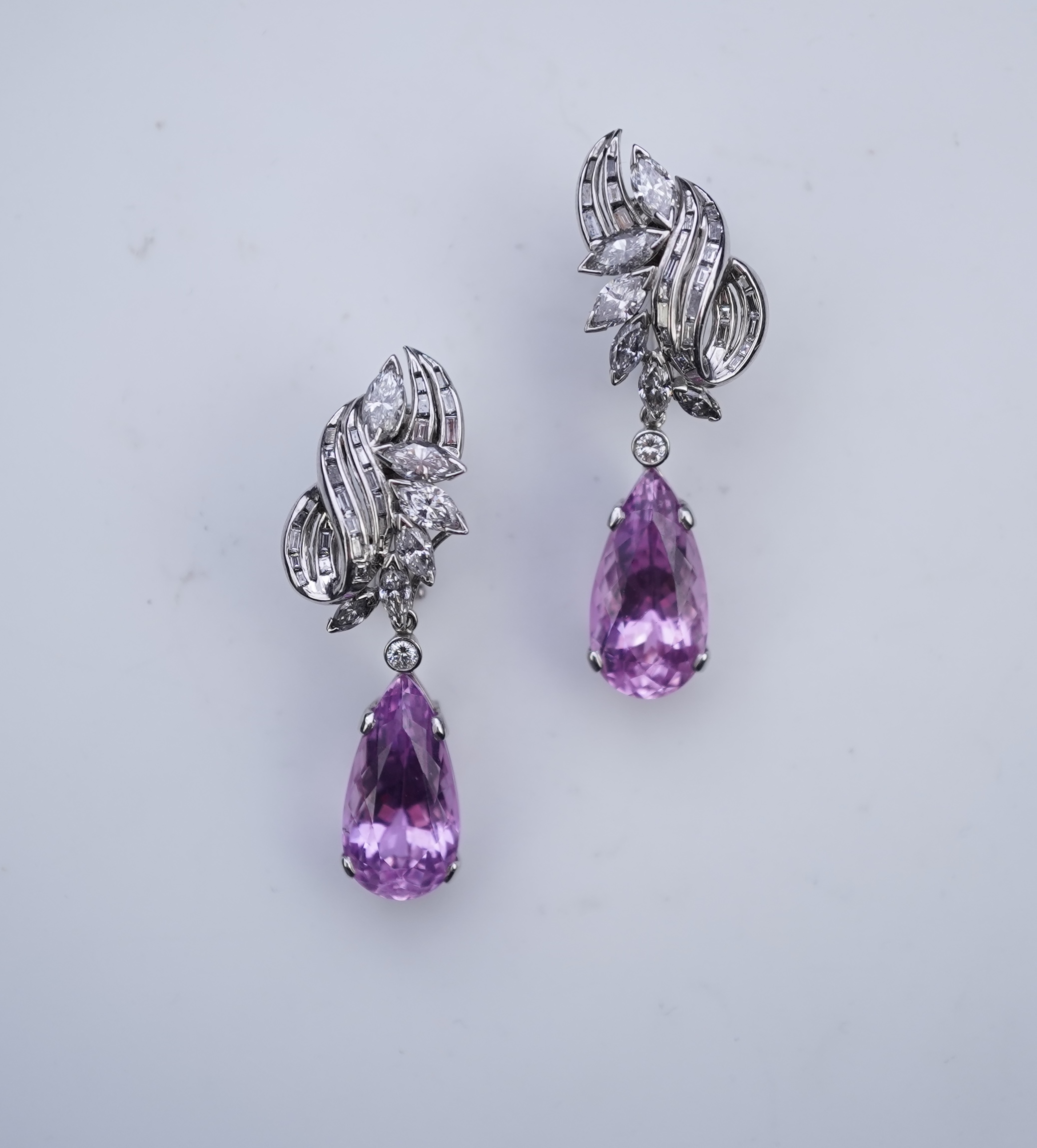 An attractive pair of 'day and night' kunzite and diamond ear clips